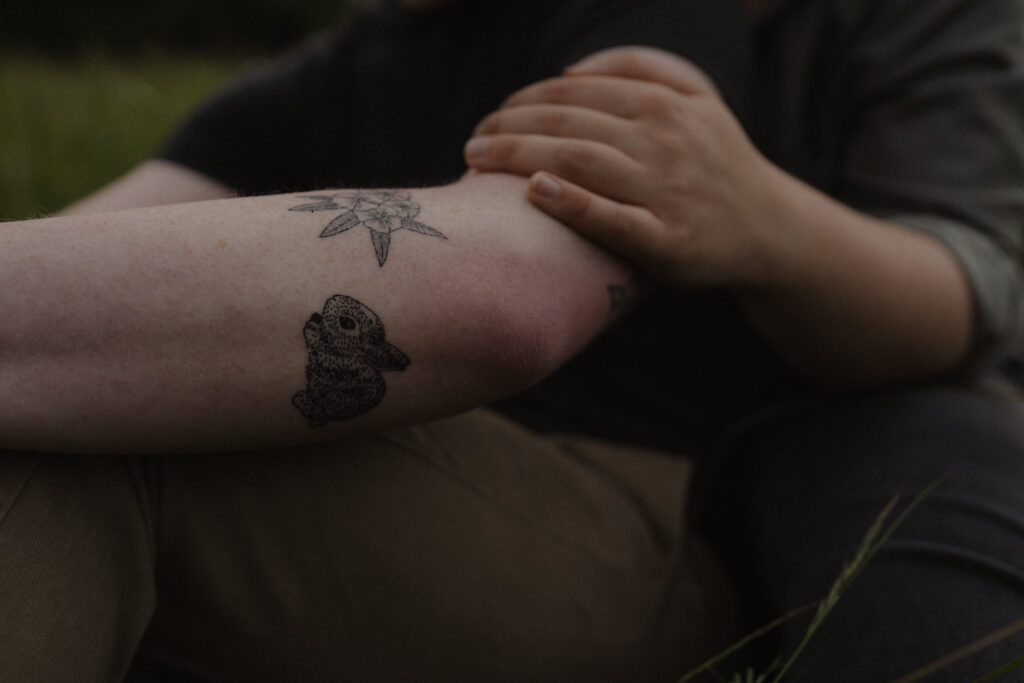 close on tattooed arm on bunny