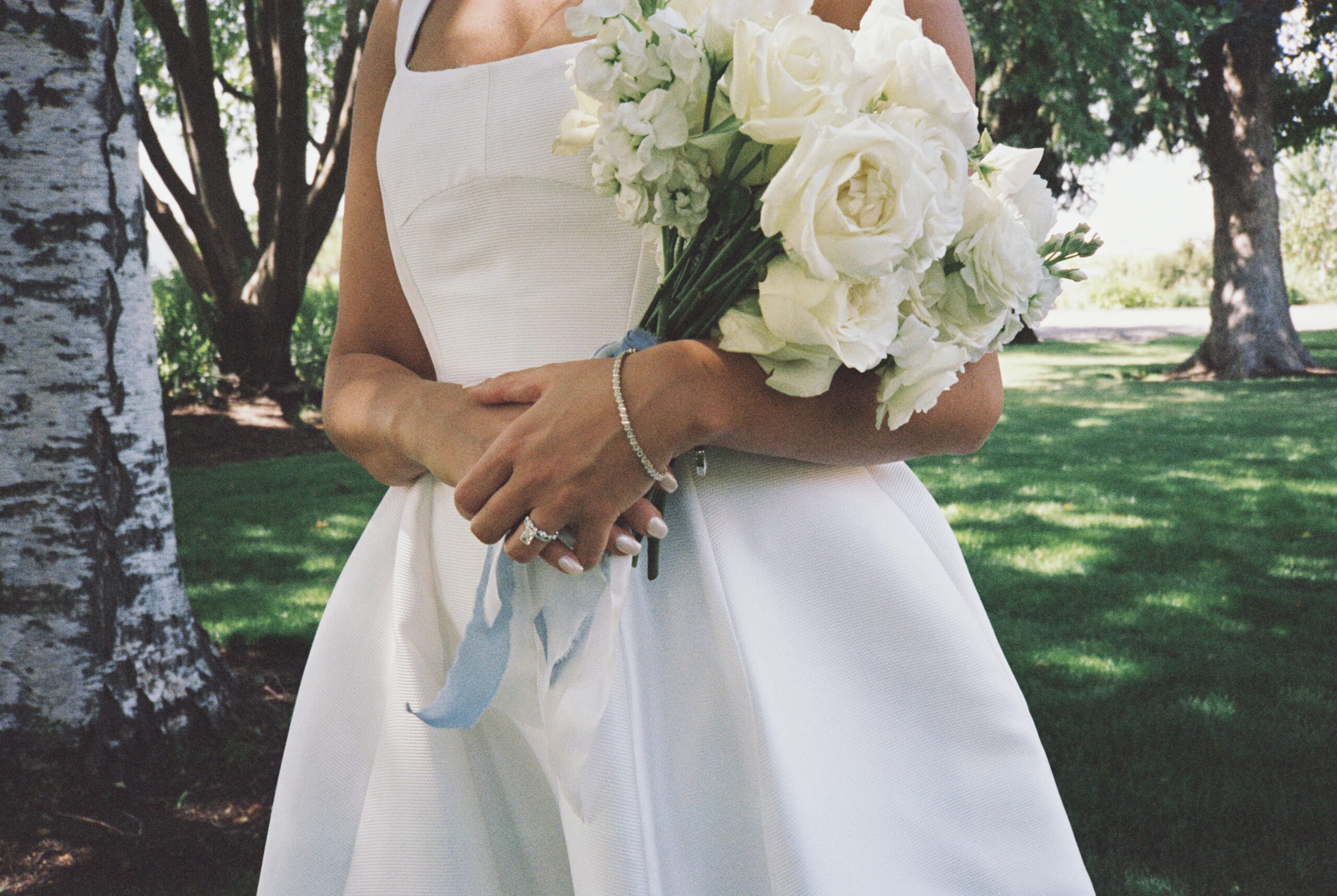bride holds bouquet at abeja winery wedding
