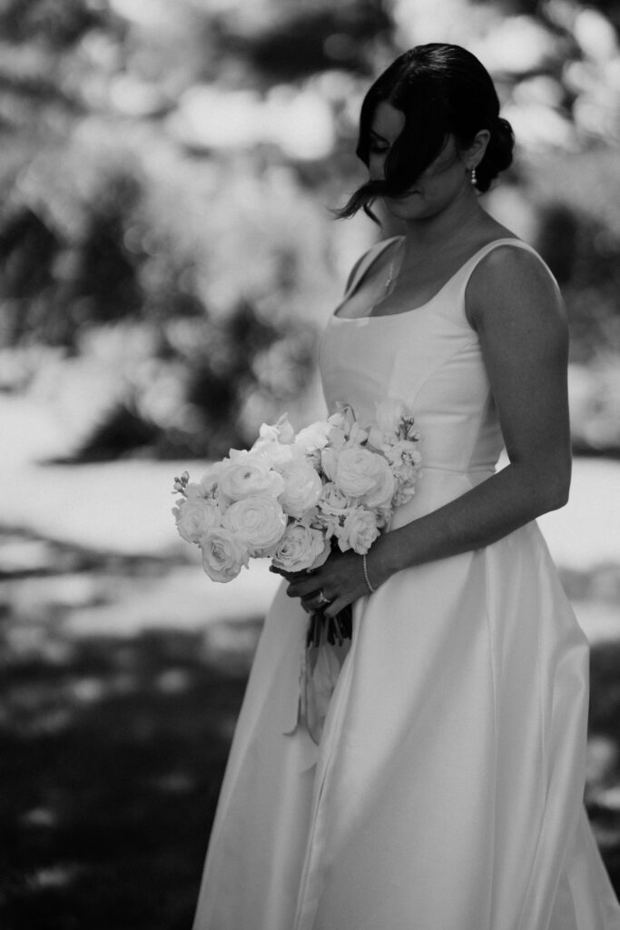 bride holds bouquet and poses at Abeja winery wedding