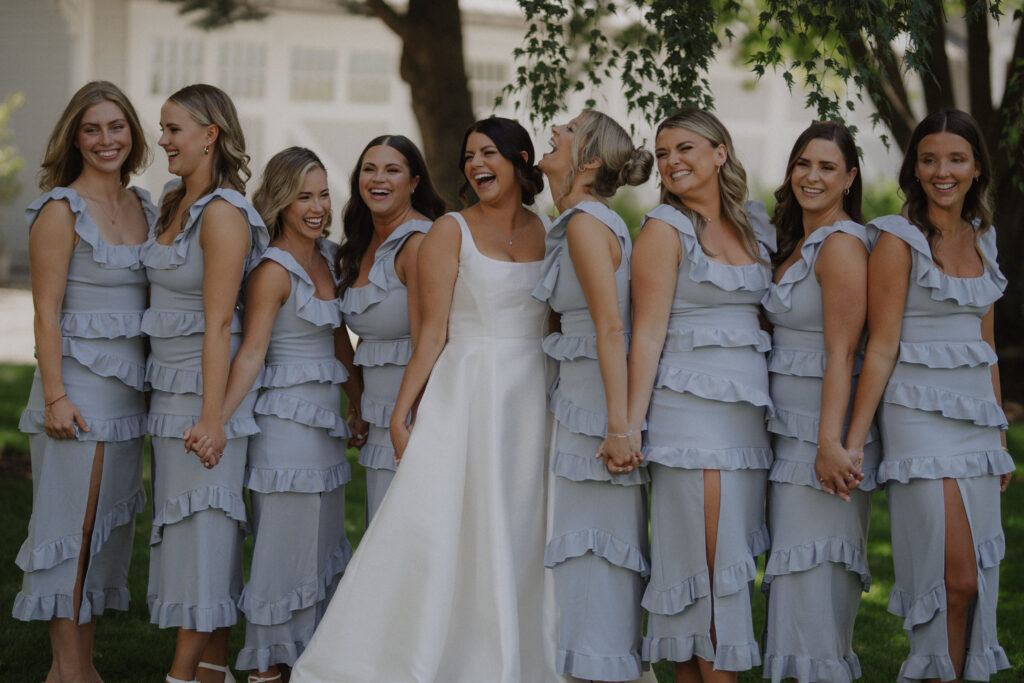 bride and bridesmaids in blue pose at Abeja Winery wedding
