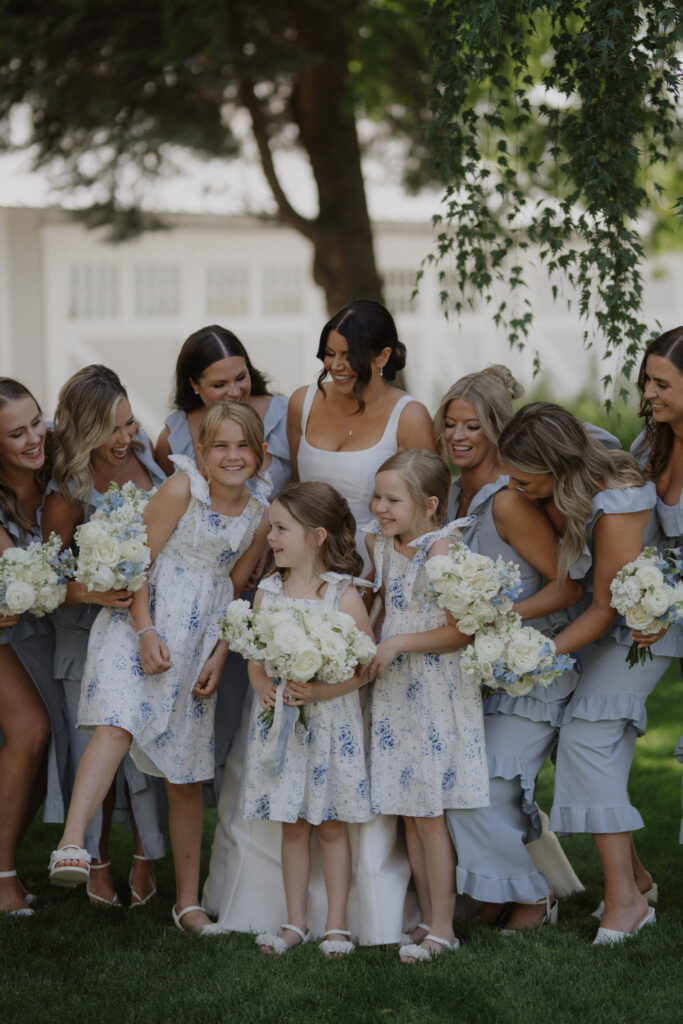bride and bridesmaids in blue pose at Abeja Winery wedding