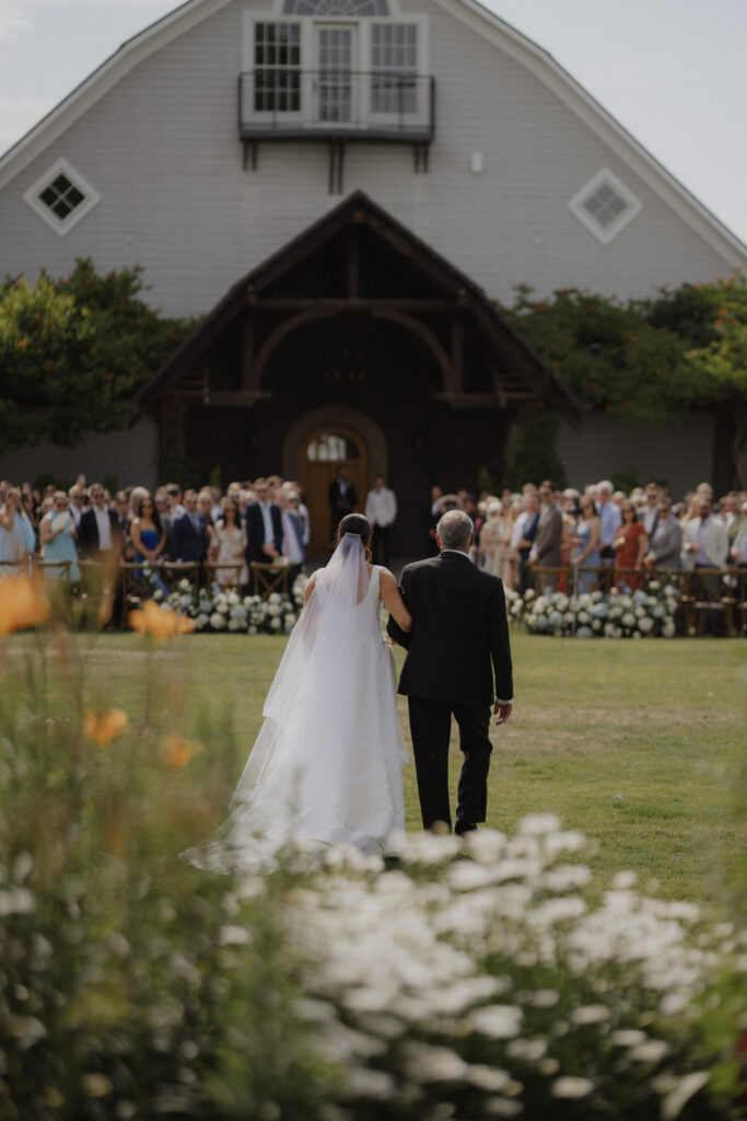 bride and her father walk down aisle at Abeja winery wedding